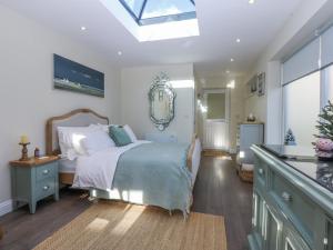 Postel nebo postele na pokoji v ubytování The Summerhouse