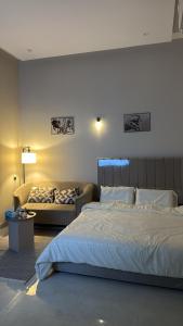 Ένα ή περισσότερα κρεβάτια σε δωμάτιο στο استديو حي البرج