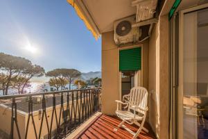 a balcony with a chair and a fan at Casa D'Amato - Nel cuore di Maiori in Maiori +23 photos