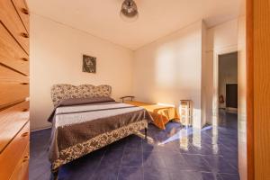 a bedroom with a bed and a table at Casa D'Amato - Nel cuore di Maiori in Maiori