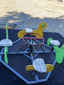 a childrens play equipment on a playground at Residencial Sra. da Lomba in Pinhanços +33 photos