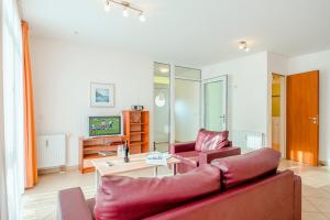 Una televisión o centro de entretenimiento en Residenz Meeresblick C Fewo 5