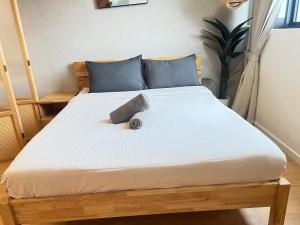 a bed in a room with a white mattress at Chambers by Lumira Haven Klcc in Kuala Lumpur +37 photos