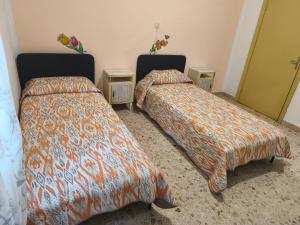 Ένα ή περισσότερα κρεβάτια σε δωμάτιο στο Casa Civitas