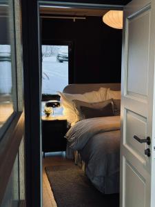 Ένα ή περισσότερα κρεβάτια σε δωμάτιο στο Fredvang Lodge, Lofoten