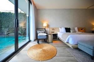 Ένα ή περισσότερα κρεβάτια σε δωμάτιο στο Malibu test apartment pool view 3