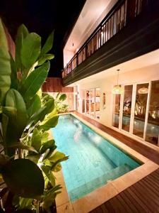 a swimming pool in the middle of a house at Villa Lulu - Uluwatu Nusa Dua in Ungasan