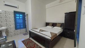 Ένα ή περισσότερα κρεβάτια σε δωμάτιο στο White Palace