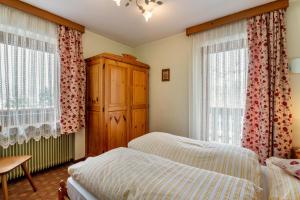 Ένα ή περισσότερα κρεβάτια σε δωμάτιο στο Appartamento Aurone