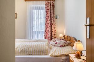 Ένα ή περισσότερα κρεβάτια σε δωμάτιο στο Appartamento Piz Boe'