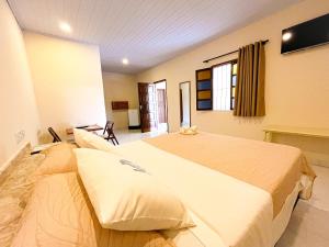 Μια τηλεόραση ή/και κέντρο ψυχαγωγίας στο Pousada do Sol