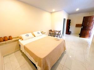 Ένα ή περισσότερα κρεβάτια σε δωμάτιο στο Pousada do Sol