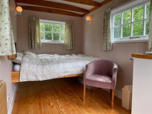 Ένα ή περισσότερα κρεβάτια σε δωμάτιο στο Riverside Retreat