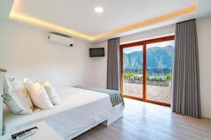 Ένα ή περισσότερα κρεβάτια σε δωμάτιο στο Vilaugusto +75 φωτογραφίες