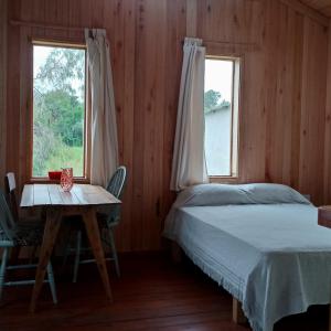 Ένα ή περισσότερα κρεβάτια σε δωμάτιο στο Cabaña entre molles