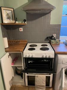 a kitchen with a white stove in a kitchen at Fox Haven in Bicester