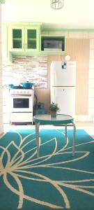 Kuchyň nebo kuchyňský kout v ubytování Central Paradise Vacation Rental