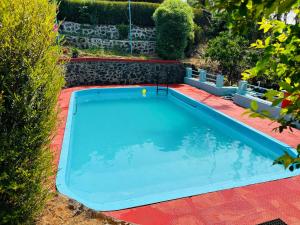 an overhead view of a swimming pool in a yard at Hill Rows Plantation and Forest Experience By GreenEscapes in Vythiri