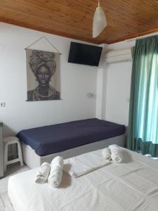 Ένα ή περισσότερα κρεβάτια σε δωμάτιο στο Νέηλυς