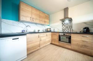 Kuchyň nebo kuchyňský kout v ubytování Le Colisée