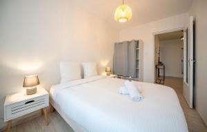 Postel nebo postele na pokoji v ubytování Le Colisée