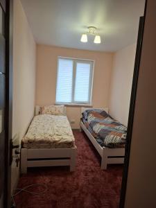 Ένα ή περισσότερα κρεβάτια σε δωμάτιο στο 13 Hostel