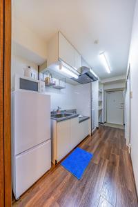 Η κουζίνα ή μικρή κουζίνα στο オーシャンビュー窓から見える景色を思い出に The琉球タワー10F