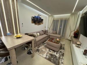 a living room with a couch and a table at The View - Luxury One bedroom Apartment in Sharm El Sheikh