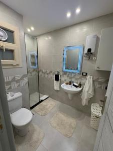 a bathroom with a toilet and a sink at The View - Luxury One bedroom Apartment in Sharm El Sheikh