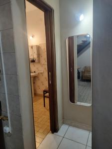 a hallway with a mirror in a room at El depto de mirta 964 Esquiu in San Bernardo +5 photos