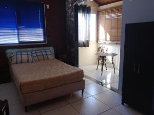 Ένα ή περισσότερα κρεβάτια σε δωμάτιο στο Hostel & Cia Itanhaém