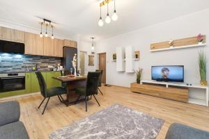 TV a/nebo společenská místnost v ubytování Apartament Luna