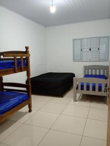 Ένα ή περισσότερα κρεβάτια σε δωμάτιο στο Chácara das Colinas