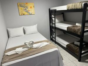 Ένα ή περισσότερα κρεβάτια σε δωμάτιο στο Pousada Siri do Mar