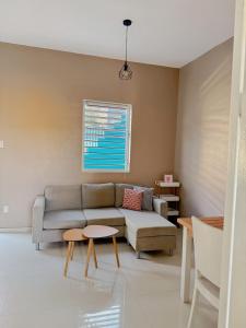 Un lugar para sentarse en Cosy Guacamaya Azul, Otrobanda