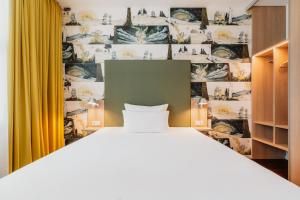 Postel nebo postele na pokoji v ubytování Grimms Hotel Hanau