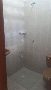 a bathroom with a shower with a toilet and a sink at Casa Bora Bora in Sopetrán