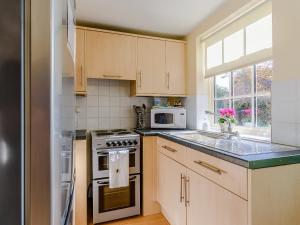 Kuchyň nebo kuchyňský kout v ubytování Estate Cottage