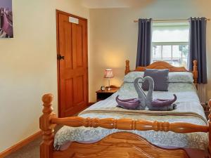 Postel nebo postele na pokoji v ubytování Estate Cottage + 8 fotografií