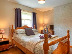 Postel nebo postele na pokoji v ubytování Estate Cottage