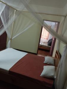 Postel nebo postele na pokoji v ubytování Auberge Côté Plage - Ex Pélican