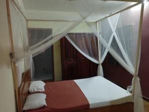 Postel nebo postele na pokoji v ubytování Auberge Côté Plage - Ex Pélican