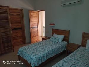 Ένα ή περισσότερα κρεβάτια σε δωμάτιο στο Beachfront apartment