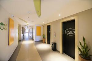 a hallway of an office with a sign on the wall at Palette Legian Beach in Legian +19 photos