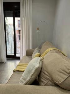 Ένα ή περισσότερα κρεβάτια σε δωμάτιο στο Modern apartment in Part Alta