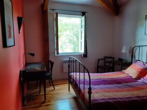 Postel nebo postele na pokoji v ubytování Le Moulin du Pont de Matar