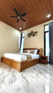 Postel nebo postele na pokoji v ubytování Pondok Murni Mesari