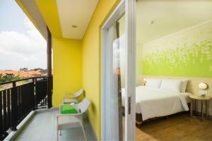 Ένα ή περισσότερα κρεβάτια σε δωμάτιο στο Palette Legian Beach +19 φωτογραφίες