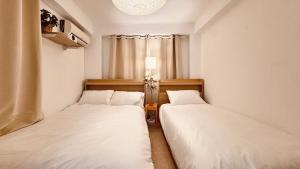 Voodi või voodid majutusasutuse Exit 4 of Hongik University toas