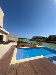 a swimming pool on the deck of a house at Hawana Salalah Resort - FV 5 in Salalah